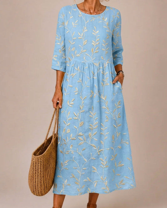 Blue dress embroidered with vintage flowers